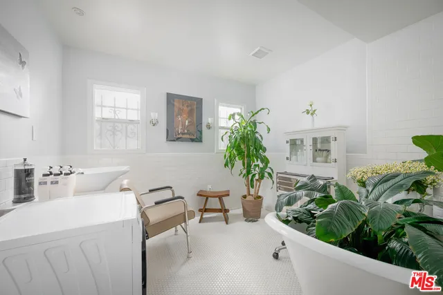 a bathroom with a sink a mirror and a toilet