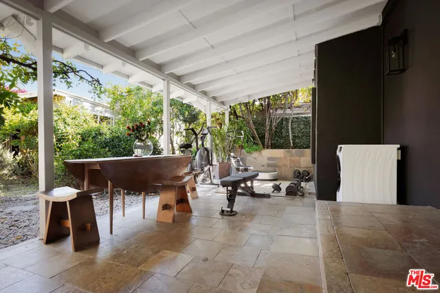 a flower plants in front of a house