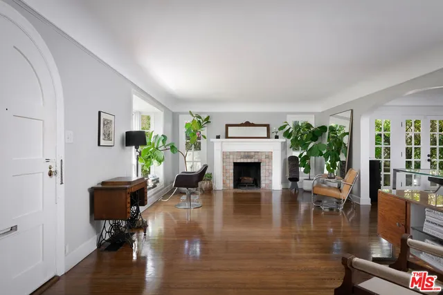 a view of a livingroom with furniture window and wooden floor