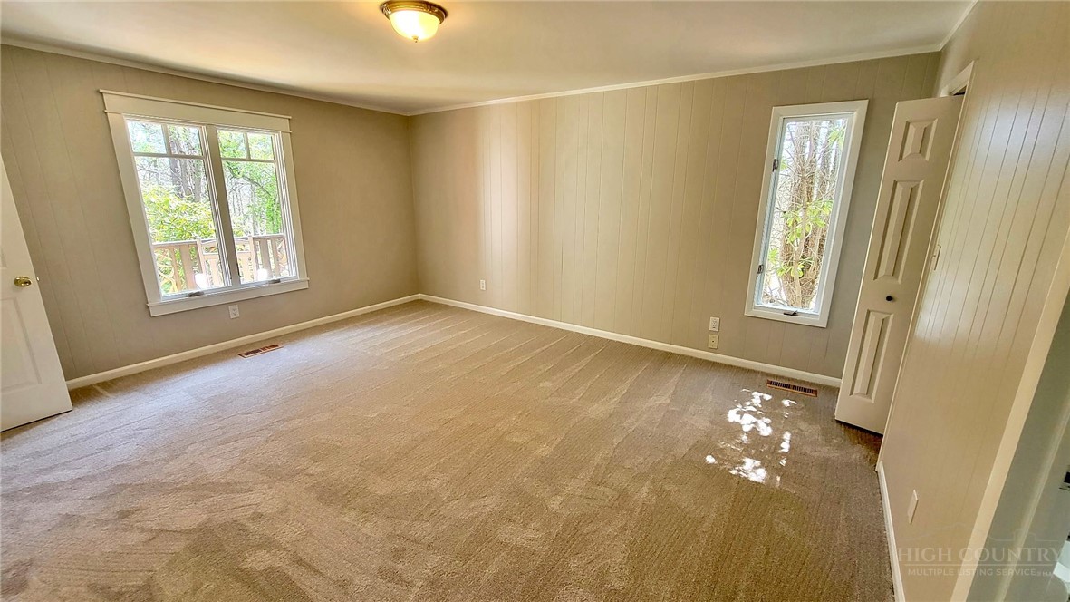 172 Yarrow Lane Boone, NC 28607 - Photo 11 of 30 wooden floor in an empty room with a window