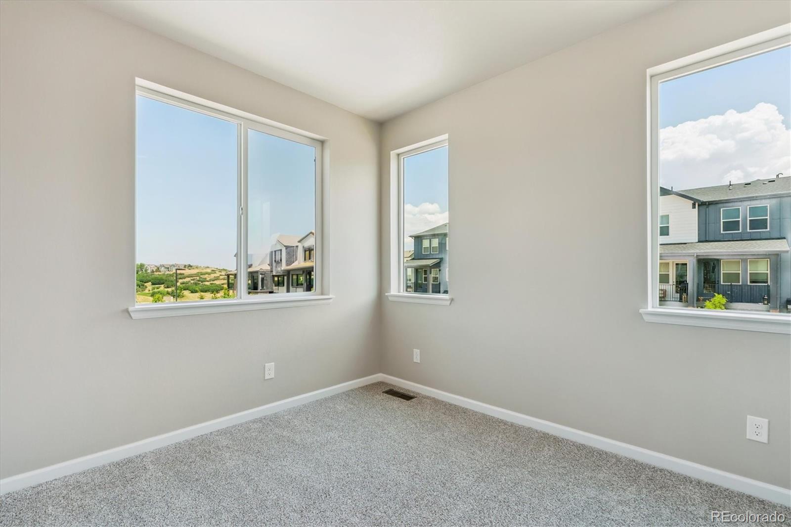 6720 Merseyside Lane Castle Pines, CO 80108 - Photo 20 of 24 a view of an empty room with a window