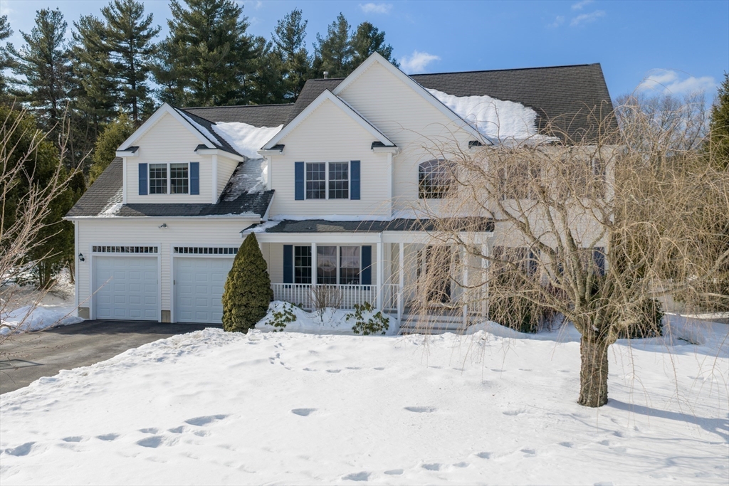 5 Apple Rock Road Millis, MA 02054 - Photo 41 of 42 a front view of a house with a yard covered in snow