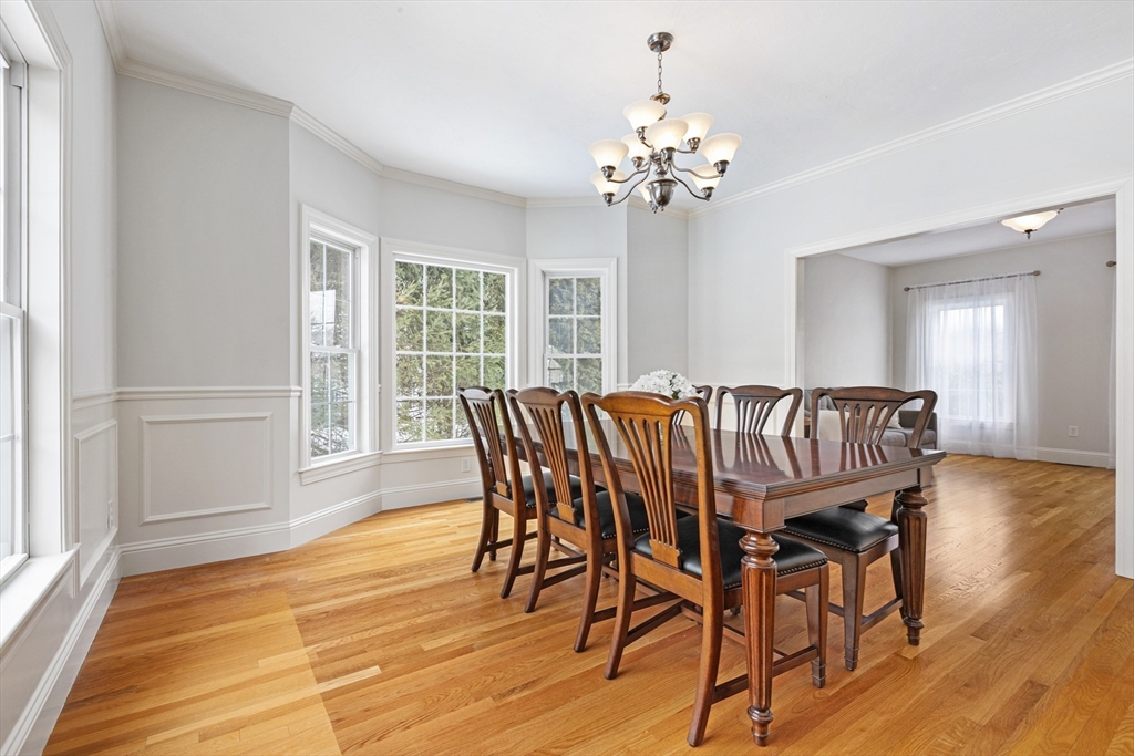 5 Apple Rock Road Millis, MA 02054 - Photo 8 of 42 a view of a dining room with furniture wooden floor and chandelier