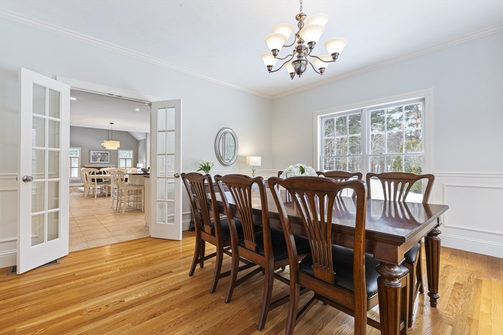 5 Apple Rock Road Millis, MA 02054 - Photo 9 of 42 a dining room with furniture a chandelier and wooden floor