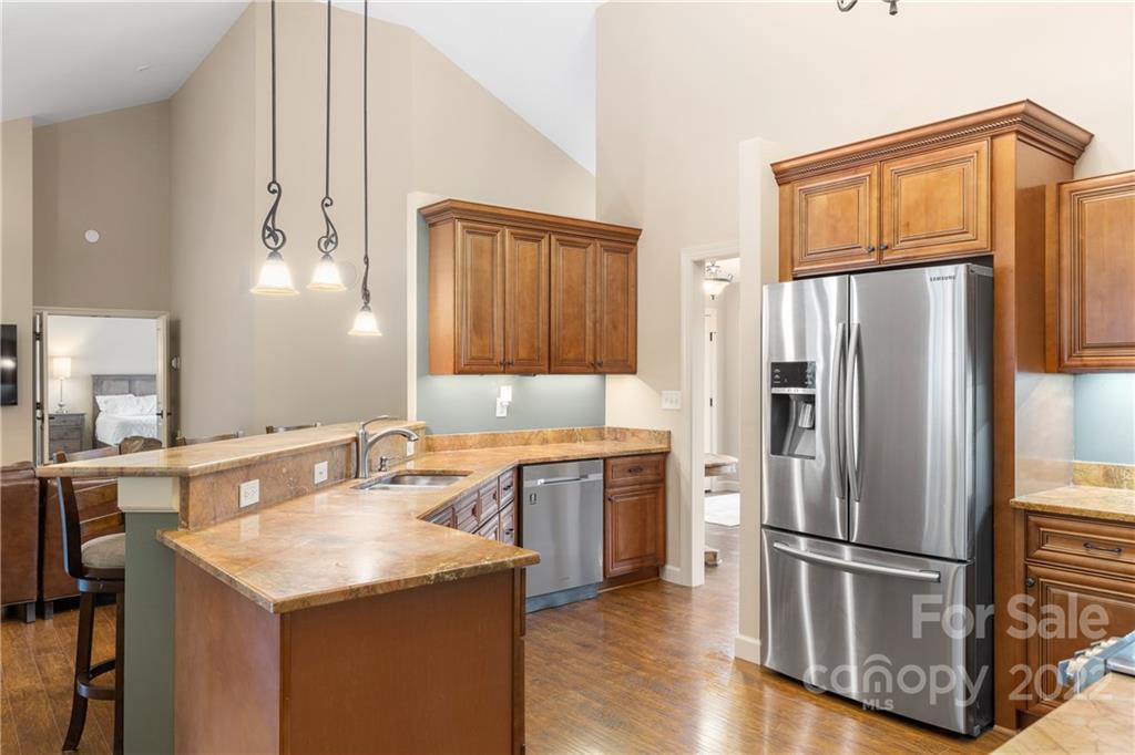 1040 Landrum Mill Road Campobello, SC 29322 - Photo 11 of 39 a kitchen with stainless steel appliances granite countertop a refrigerator a sink and a stove