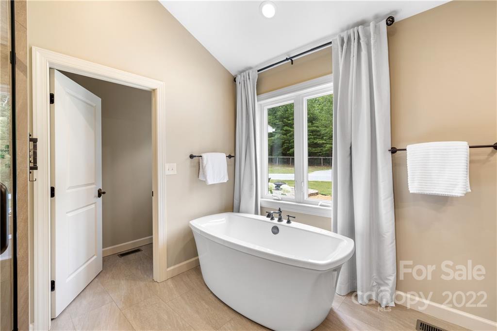 1040 Landrum Mill Road Campobello, SC 29322 - Photo 17 of 39 a bathroom with a sink and a bathtub