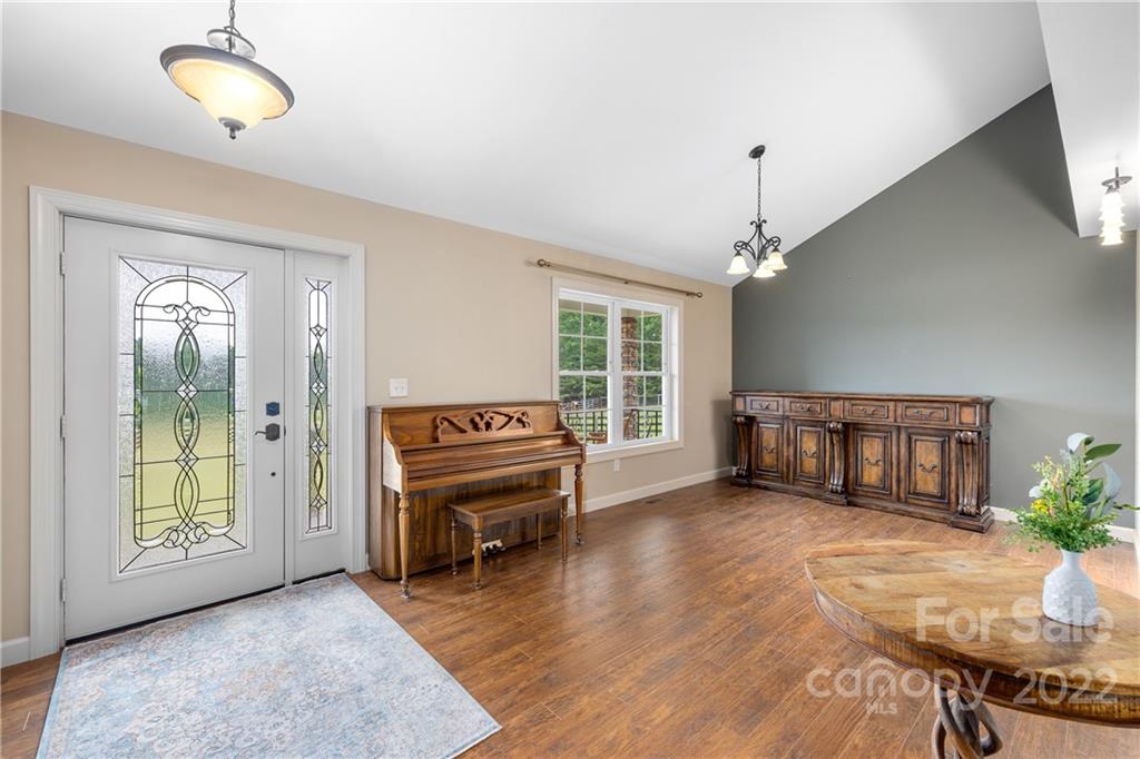 1040 Landrum Mill Road Campobello, SC 29322 - Photo 6 of 39 a living room with furniture and a wooden floor
