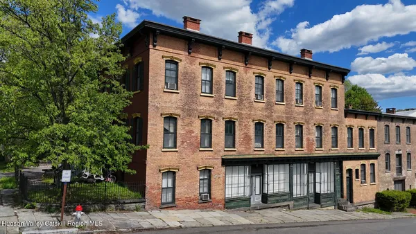 a front view of residential building with street view