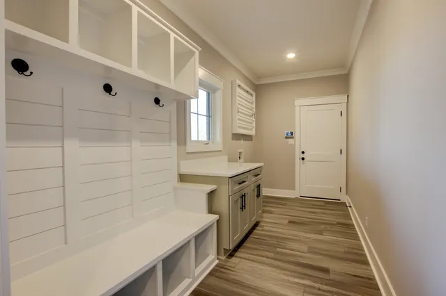 a view of an entryway with wooden floor