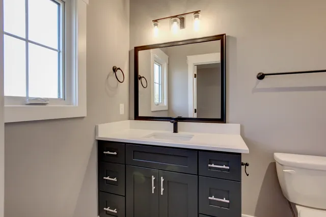 a white bath tub sitting next to a toilet