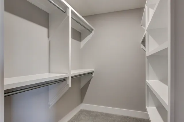 a view of empty room with ceiling fan