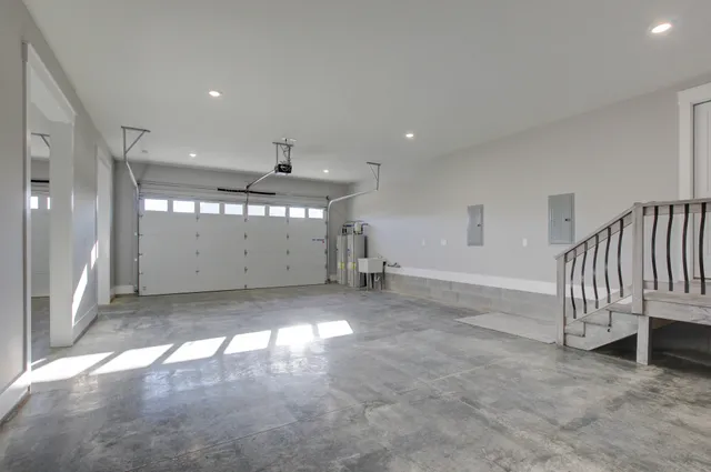 en empty room with windows and ceiling fan