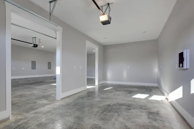 a view of hallway with wooden floor