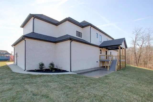 a view of outdoor space with deck and yard