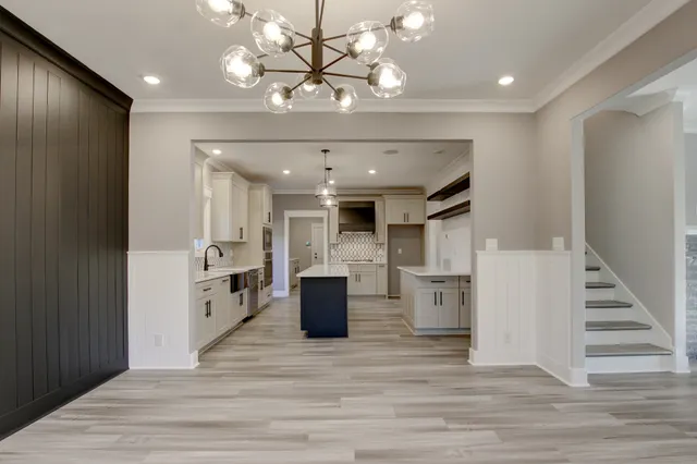 a view of kitchen with cabinets and wooden floor