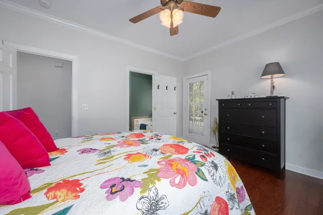 a spacious bathroom with a granite countertop sink and a mirror