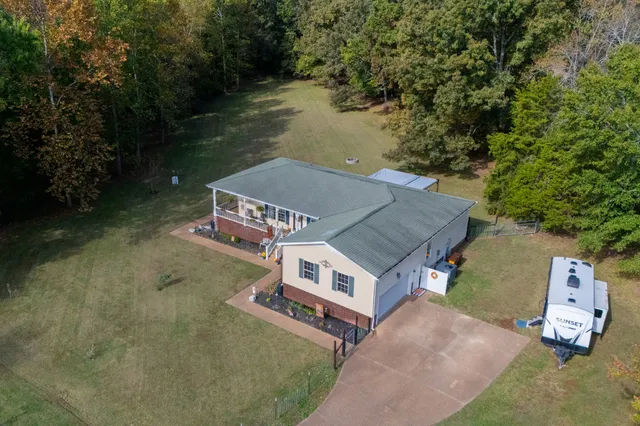 aerial view of a house with a big yard