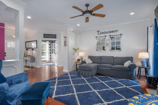 a living room with furniture and a rug