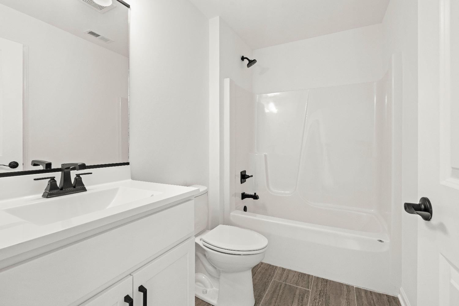 1036 Hwy 330 Griffith In 46319 Griffith, IN 46319 - Photo 23 of 27 a bathroom with a sink a toilet and a mirror