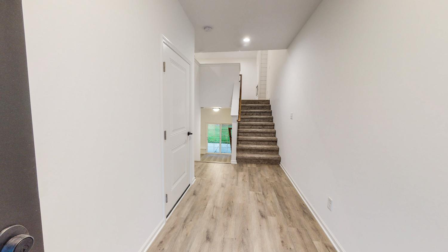 1036 Hwy 330 Griffith In 46319 Griffith, IN 46319 - Photo 26 of 27 a view of a hallway with wooden floor