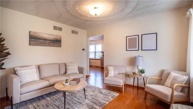 a living room with furniture and a rug