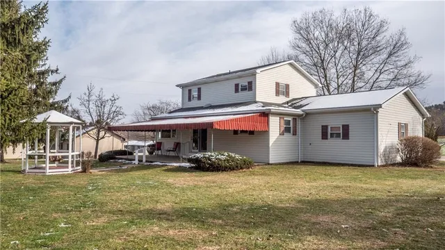 a front view of a house with garden