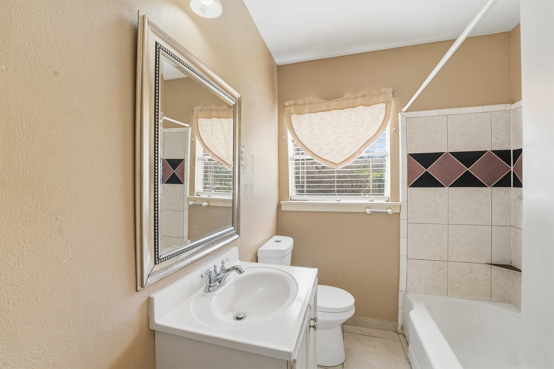 134 Obion Road Houston, TX 77076 - Photo 8 of 14 a bathroom with a sink and a mirror