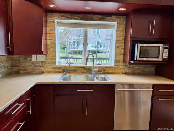 a kitchen with a sink and a window