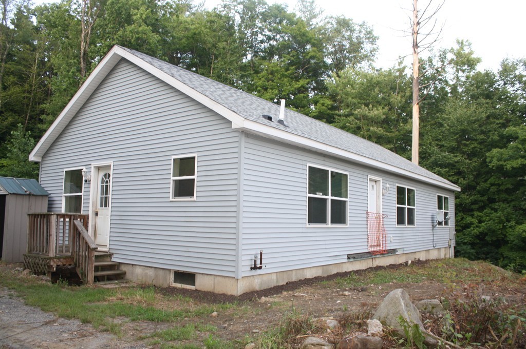 429 Main Road Colrain, MA 01340 - Photo 3 of 12 a view of a house with a yard