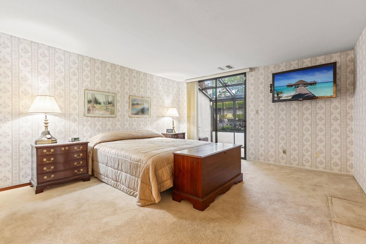 200 P Street, Unit E11 Sacramento, CA 95814 - Photo 13 of 21 a spacious bedroom with a bed and dresser