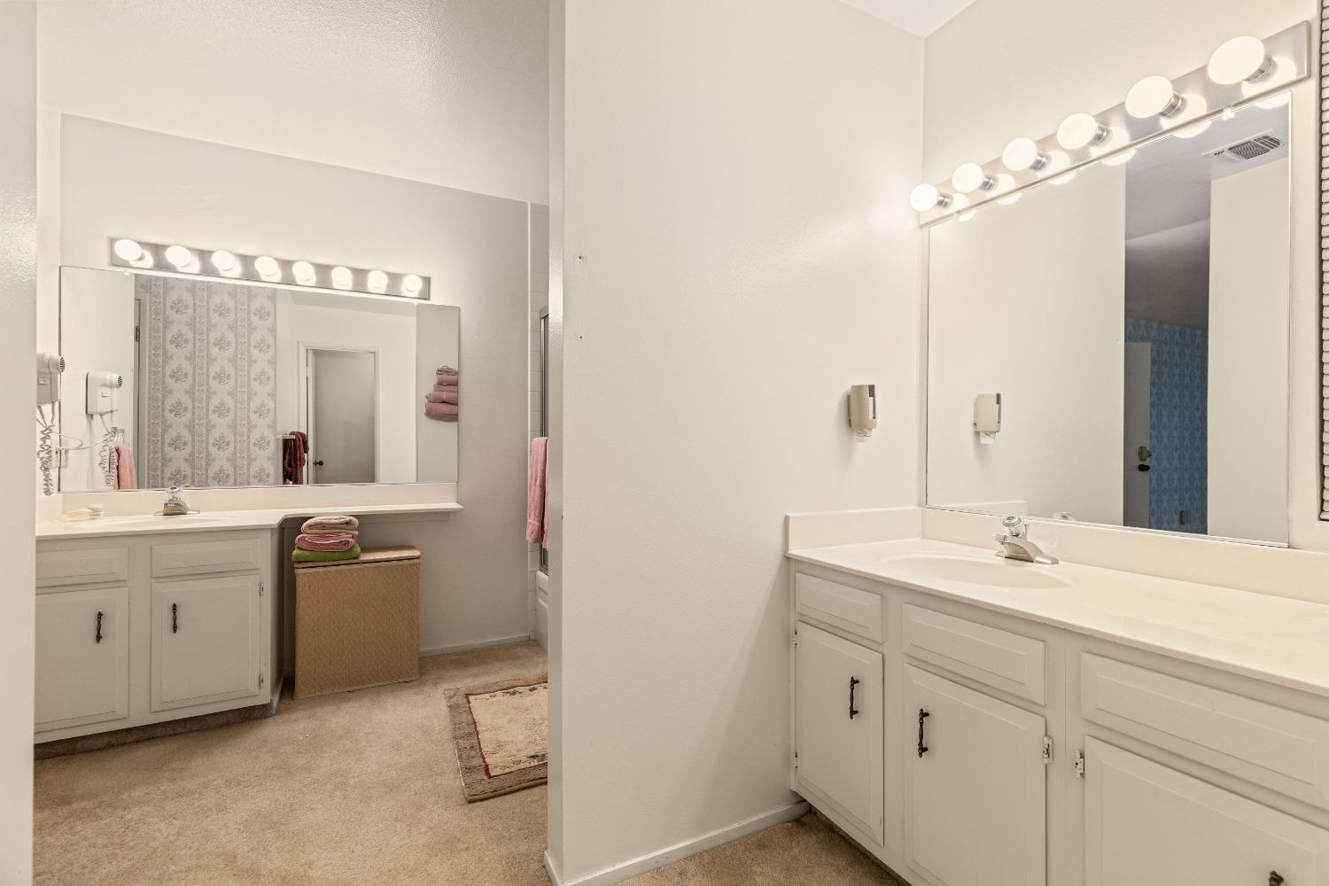 200 P Street, Unit E11 Sacramento, CA 95814 - Photo 16 of 21 a bathroom with a double vanity sink mirror and bathtub
