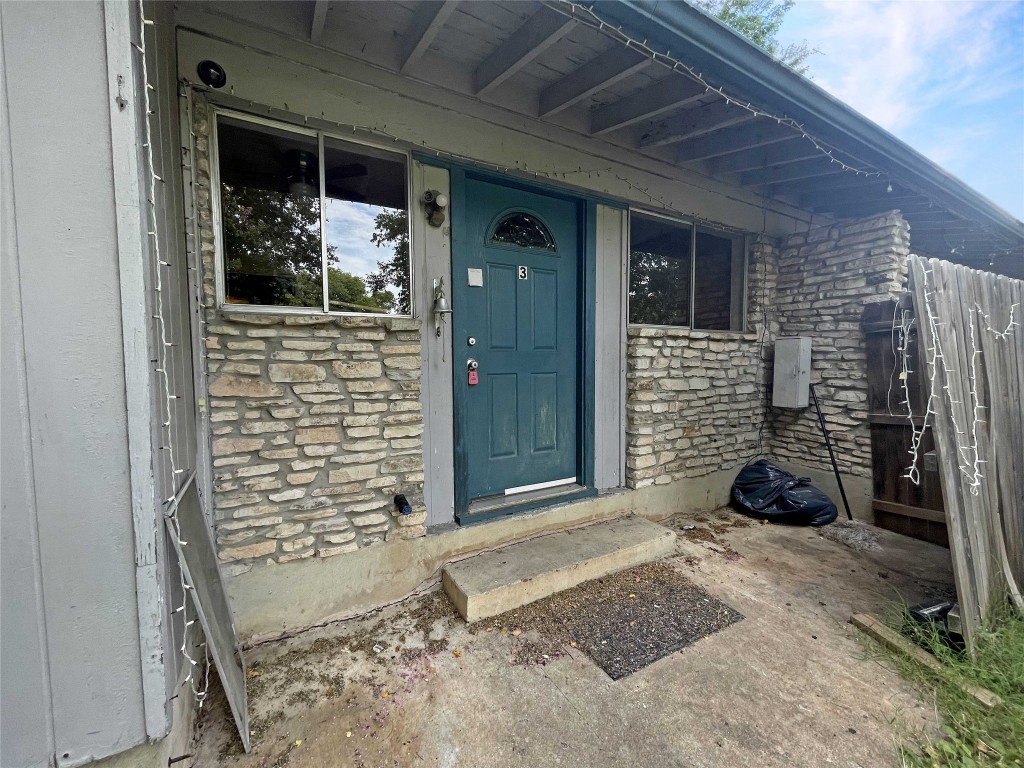 2503 Cecil Drive, Unit C Austin, TX 78744 - Photo 6 of 8 a room with a couch