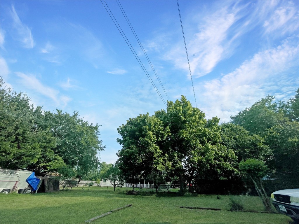 2503 Cecil Drive, Unit C Austin, TX 78744 - Photo 8 of 8 a backyard of a house with lots of green space