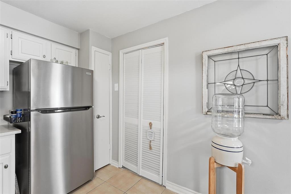 6220 Bentwood Trail, Unit 908 Dallas, TX 75252 - Photo 13 of 40 a metallic refrigerator freezer sitting in a kitchen