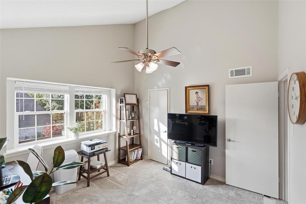 6220 Bentwood Trail, Unit 908 Dallas, TX 75252 - Photo 16 of 40 a living room with furniture and a flat screen tv