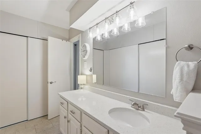 a bathroom with a sink and mirror