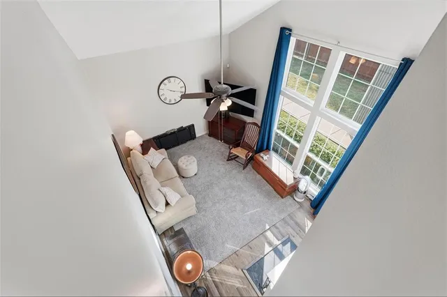 a view of living room with furniture and a window