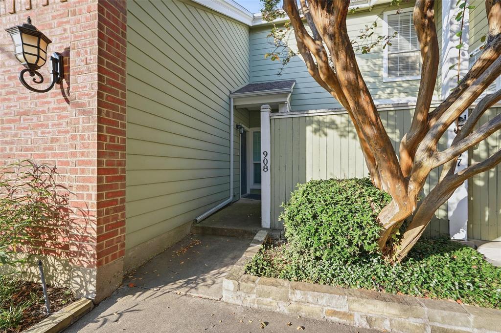 6220 Bentwood Trail, Unit 908 Dallas, TX 75252 - Photo 3 of 40 a front view of a house with garden