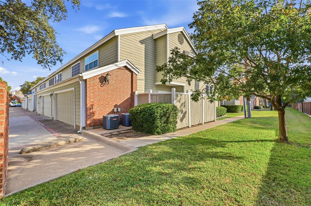 6220 Bentwood Trail, Unit 908 Dallas, TX 75252 - Photo 33 of 40 a view of a house with backyard and trees