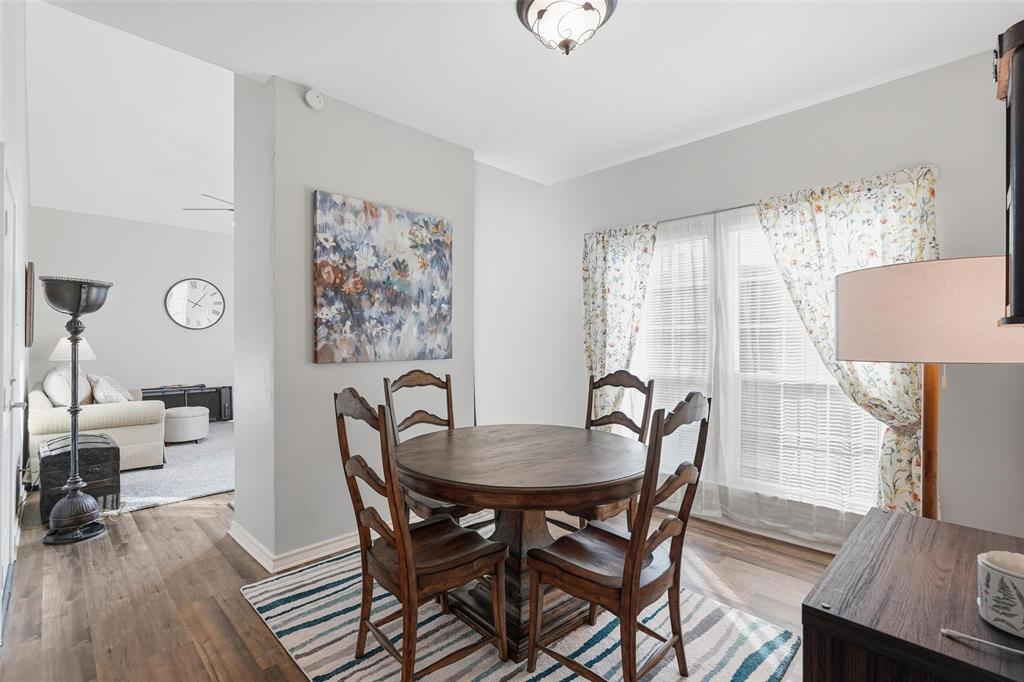 6220 Bentwood Trail, Unit 908 Dallas, TX 75252 - Photo 5 of 40 a dining room with furniture and wooden floor