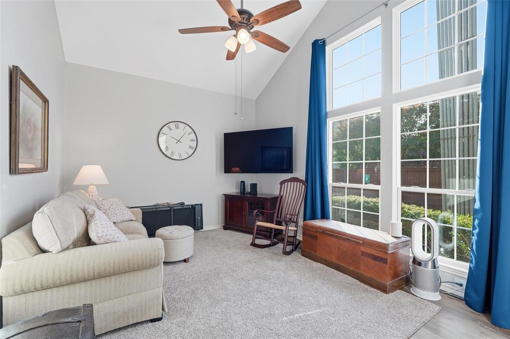 6220 Bentwood Trail, Unit 908 Dallas, TX 75252 - Photo 6 of 40 a living room with furniture a flat screen tv and a large window