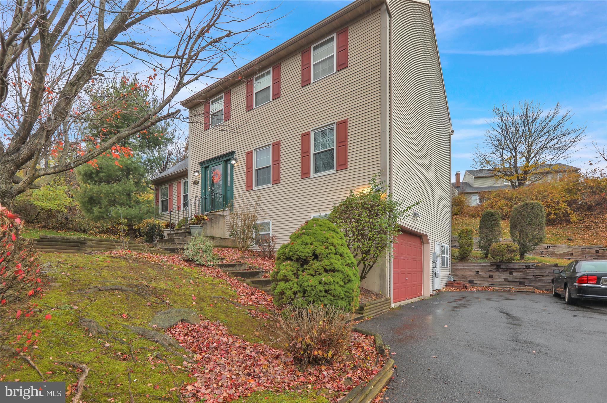 1189 Cedar Top Road Reading, PA 19607 - Photo 1 of 38 a front view of a house with garden