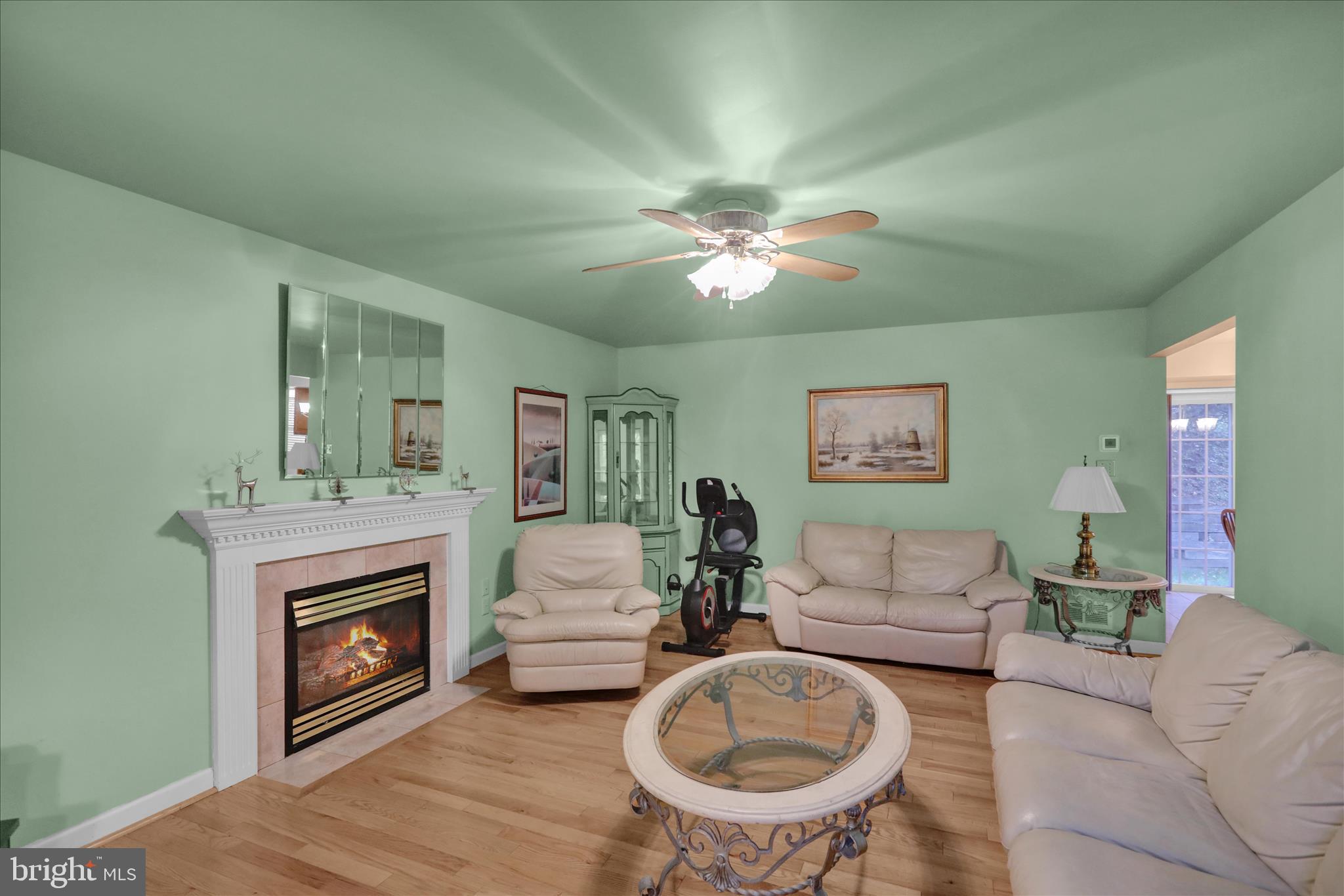 1189 Cedar Top Road Reading, PA 19607 - Photo 16 of 38 a living room with furniture a fireplace and a chandelier