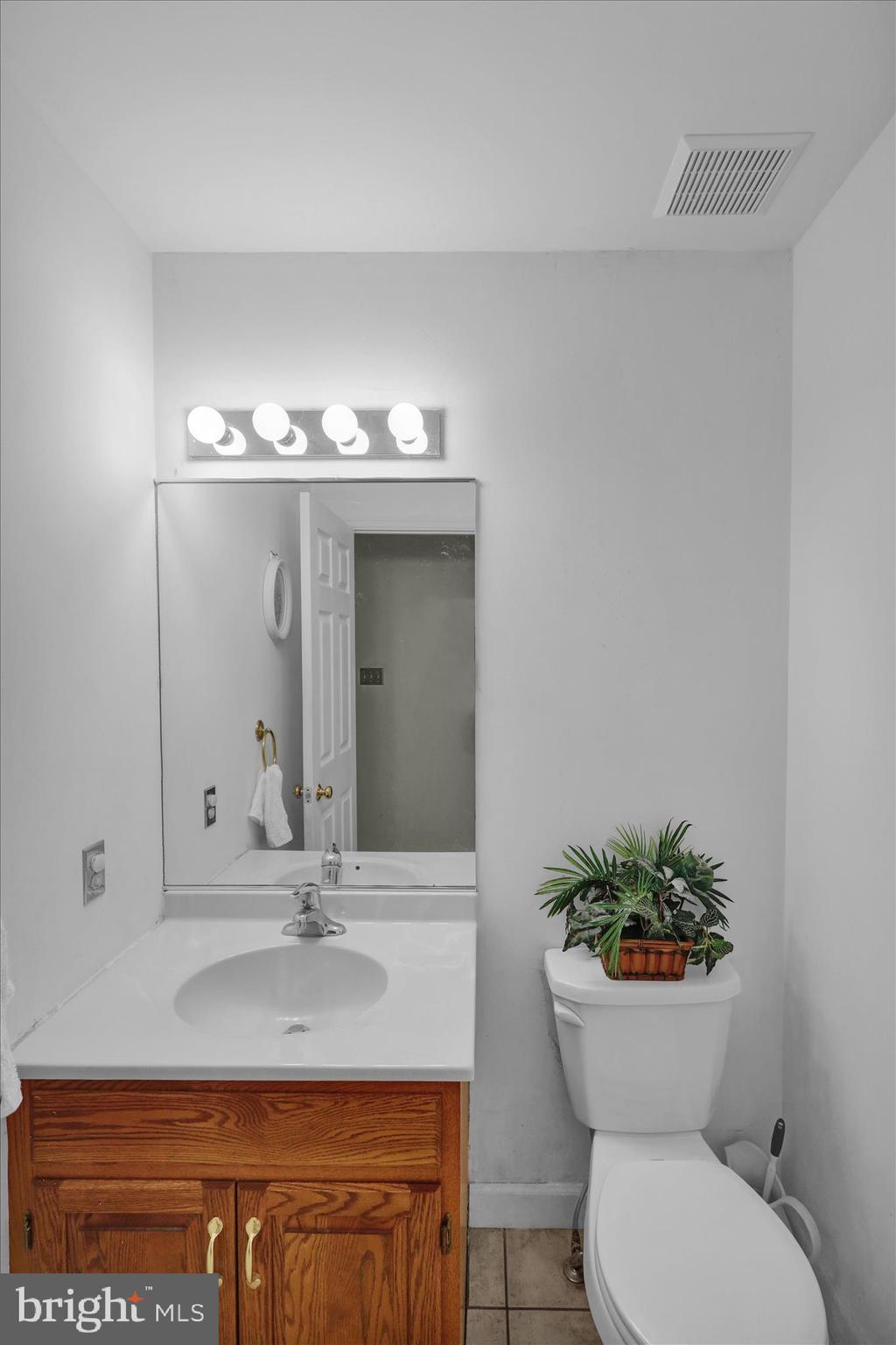 1189 Cedar Top Road Reading, PA 19607 - Photo 20 of 38 a bathroom with a sink a toilet and mirror