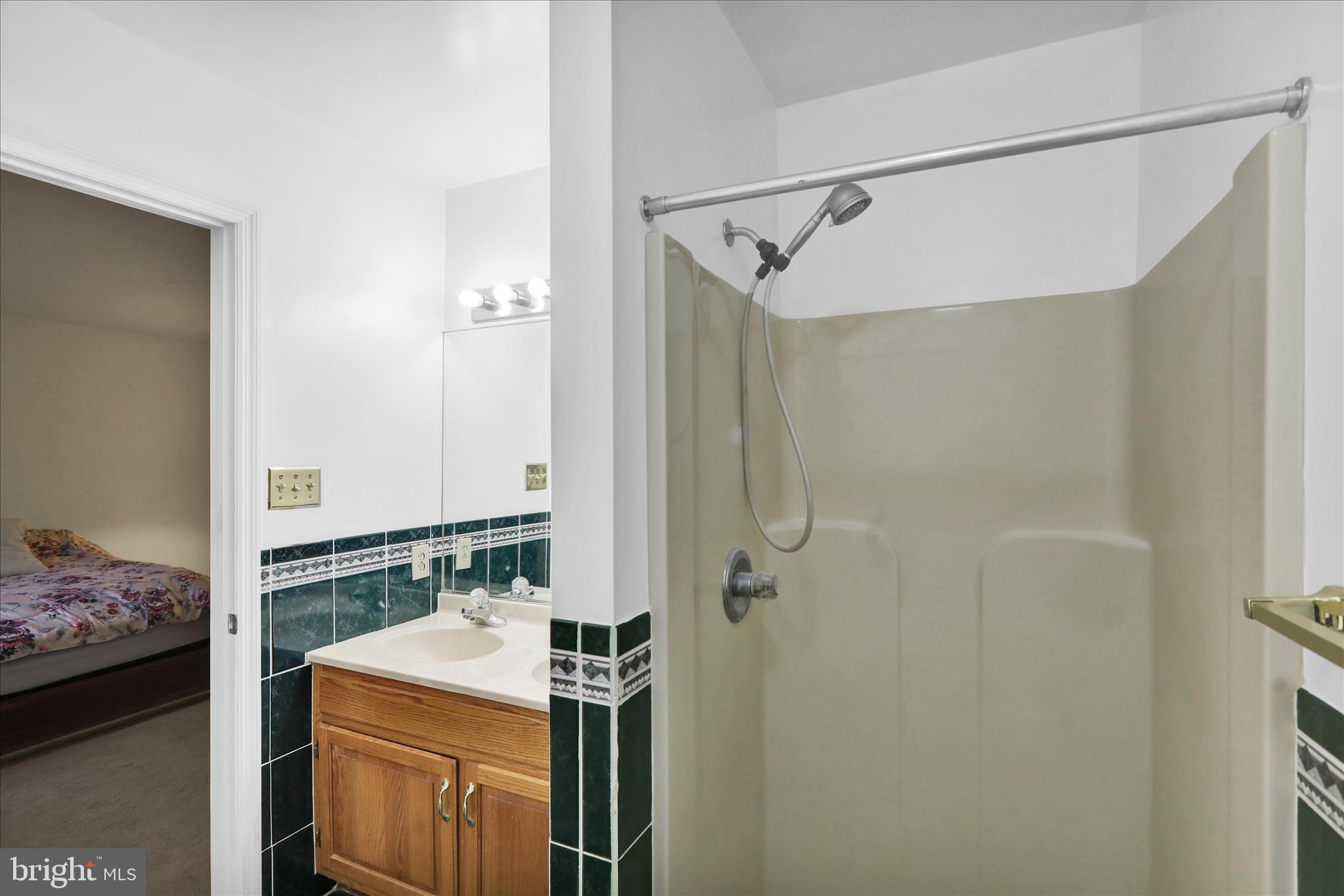 1189 Cedar Top Road Reading, PA 19607 - Photo 31 of 38 a bathroom with a sink vanity and shower
