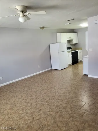 a view of a kitchen with a dishwasher and a refrigerator