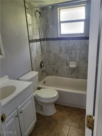 a bathroom with a toilet sink and a bathtub