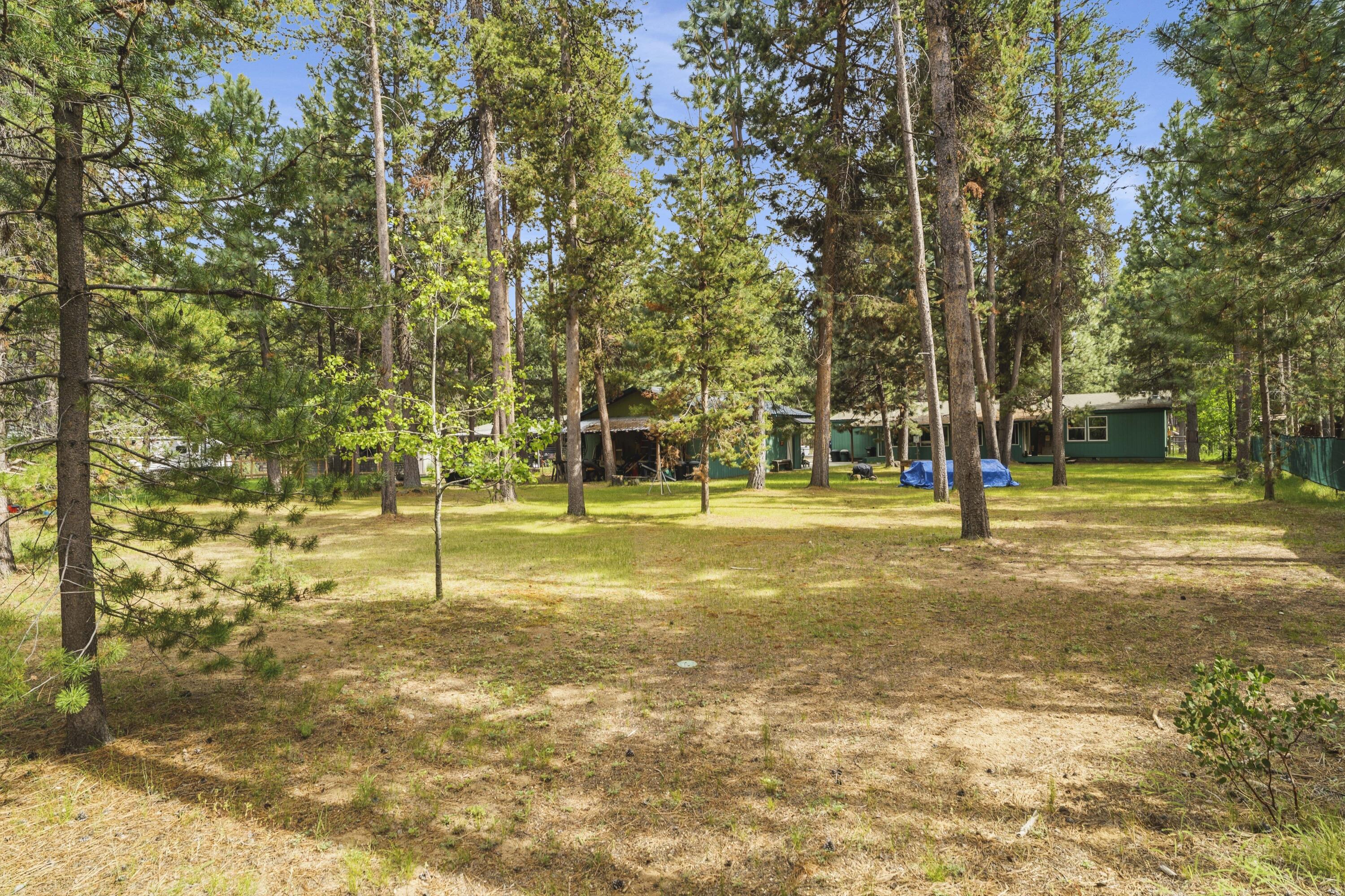 16928 Covina Road Bend, OR 97707 - Photo 32 of 48 a swimming pool with trees in the background