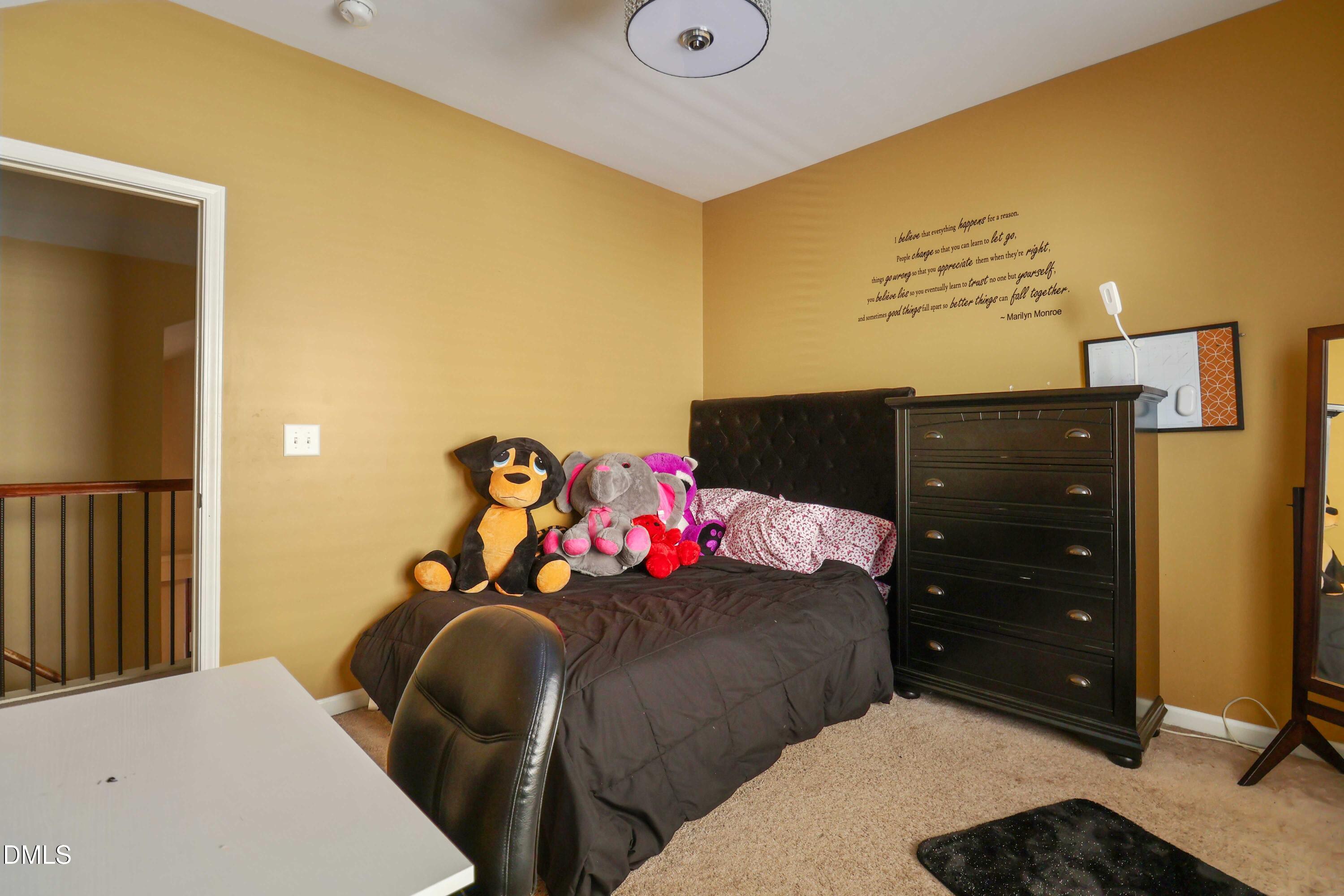 3152 Landing Falls Lane Raleigh, NC 27616 - Photo 19 of 29 a bedroom with a bed and a dresser