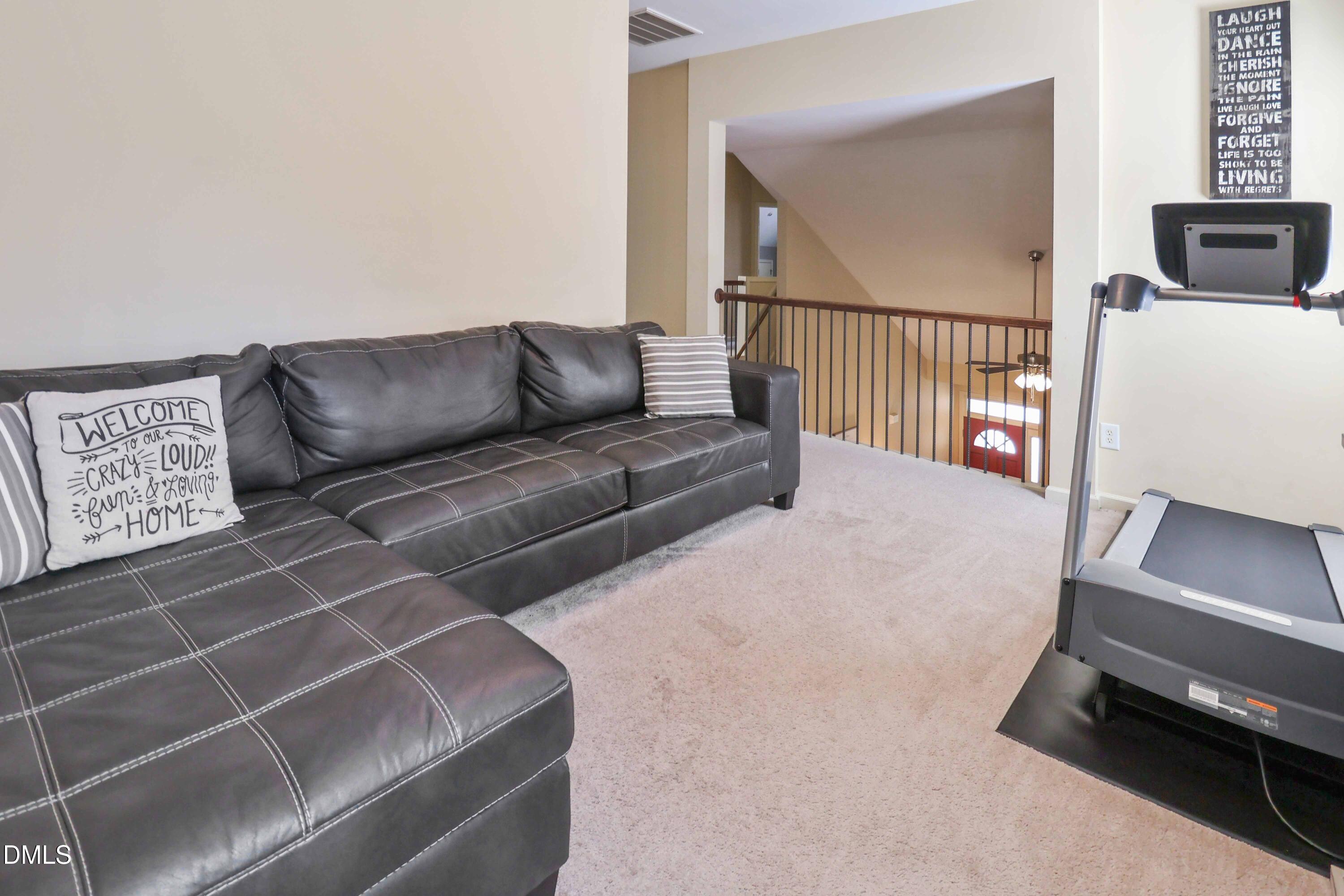 3152 Landing Falls Lane Raleigh, NC 27616 - Photo 23 of 29 a living room with furniture and a window